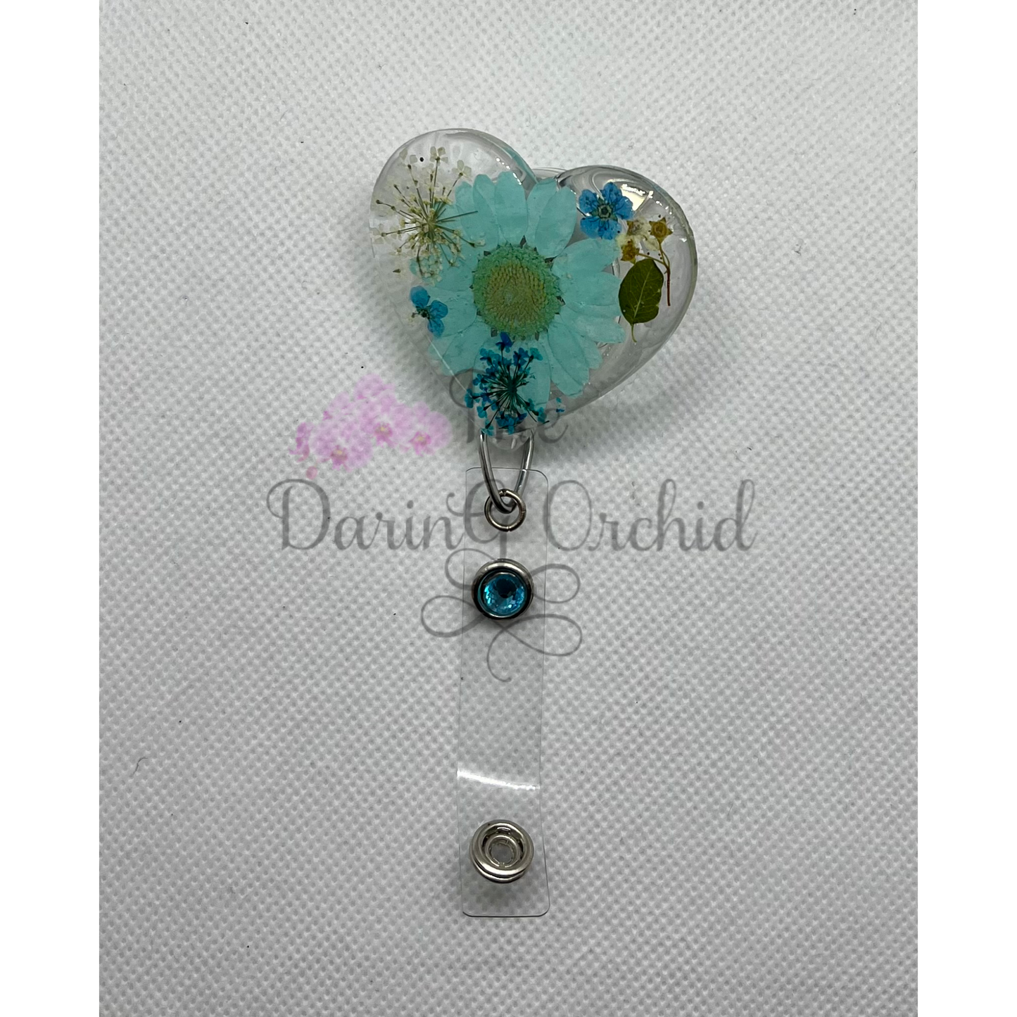 Dried flowers badge reel, heart shape, blue flowers