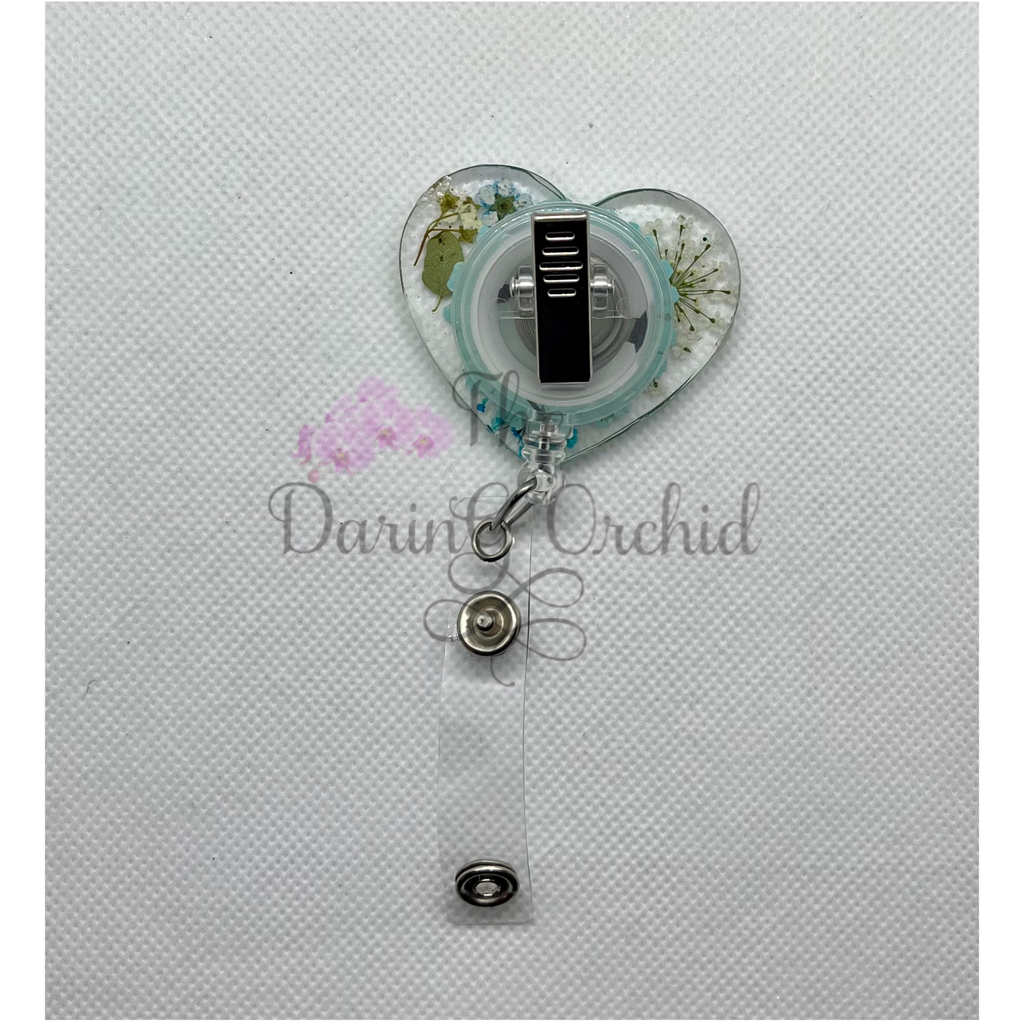 Dried flowers badge reel, heart shape, blue flowers