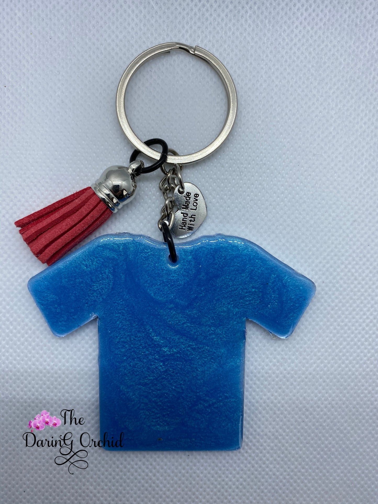 Superhero in scrubs shirt keychain Red and blue